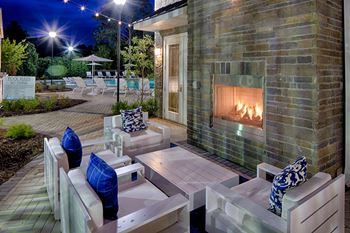 Stunning Outdoor Fireplace with Lounge Seating